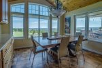 Dining Area with large windows overlooking the view of the valley and the lake